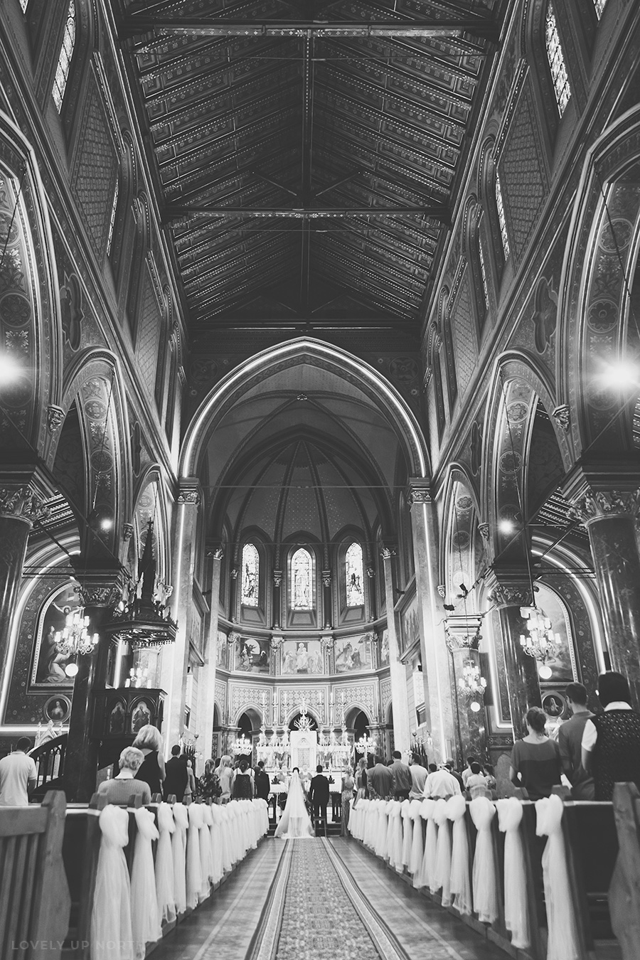 Yorkshire photographer capturing a bride and groom inside a church, tying the knot