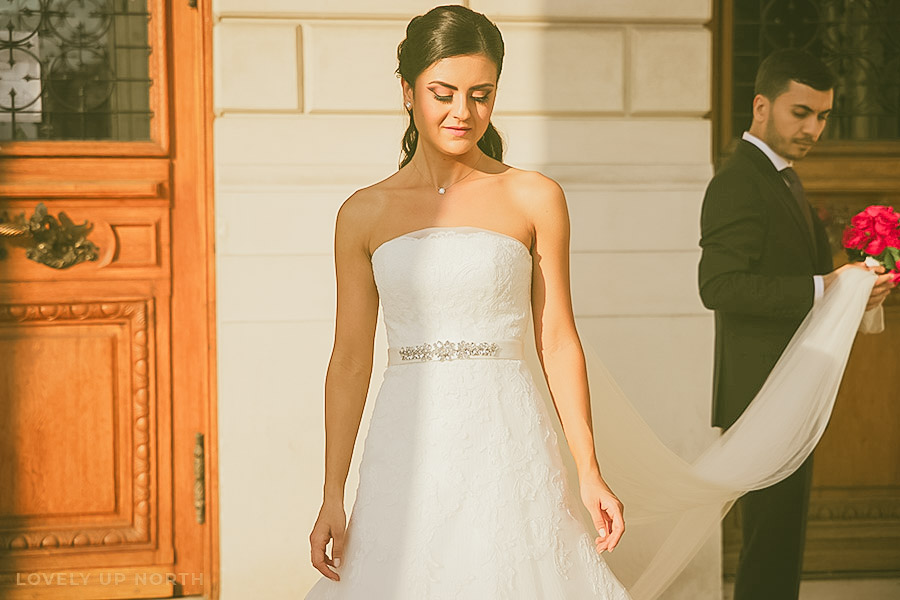 Yorkshire photographer capturing a bride's portrait with her groom in the background
